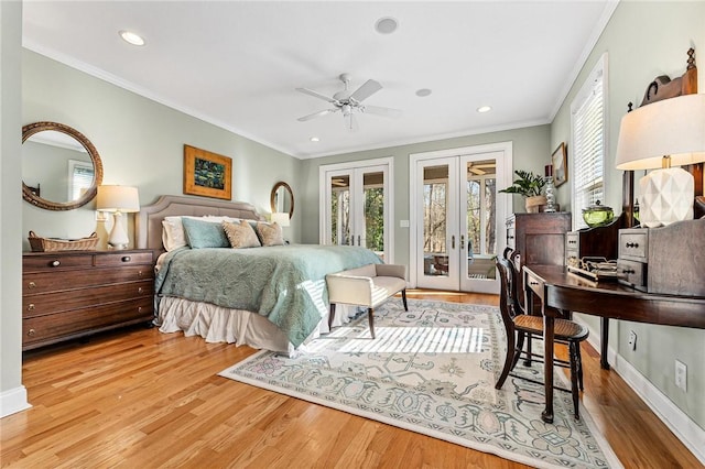 bedroom with multiple windows, access to outside, light hardwood / wood-style floors, and french doors