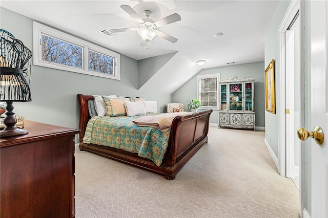 carpeted bedroom featuring vaulted ceiling and ceiling fan