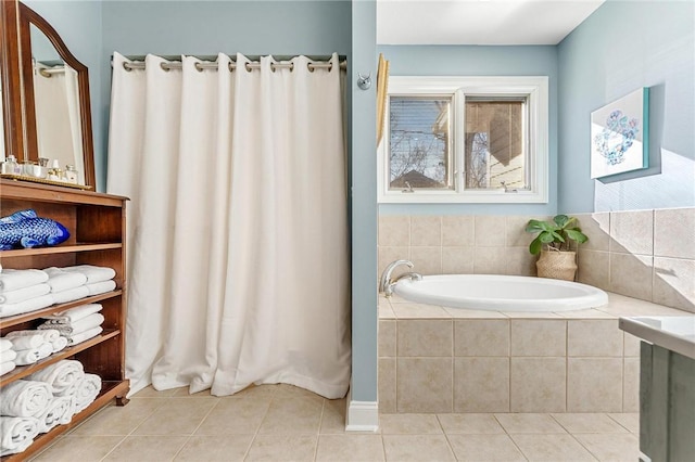 bathroom with tile patterned flooring and a relaxing tiled tub