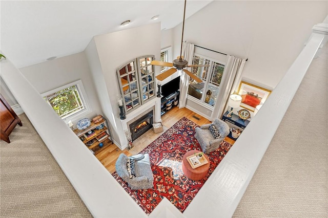 living room featuring hardwood / wood-style flooring and ceiling fan