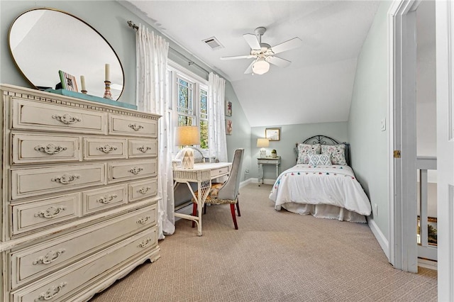 bedroom featuring ceiling fan, light colored carpet, and vaulted ceiling