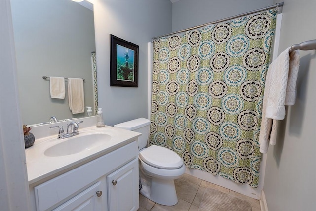 bathroom featuring vanity, tile patterned floors, and toilet