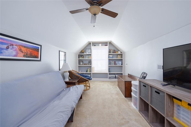 interior space with vaulted ceiling, built in features, and ceiling fan