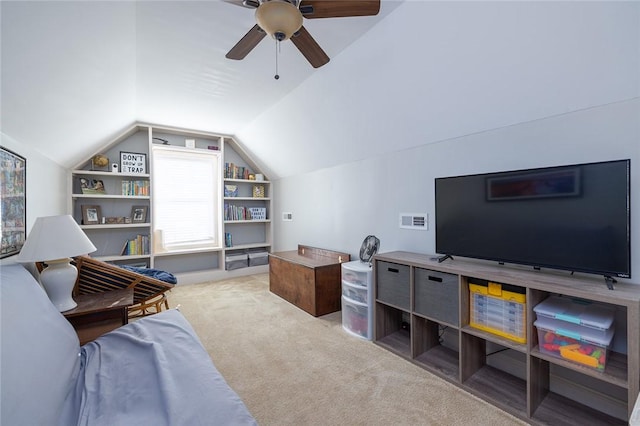 interior space featuring lofted ceiling, carpet floors, and ceiling fan