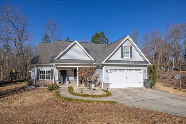 view of front of property featuring a porch and a garage