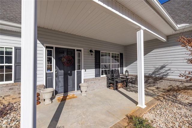 doorway to property featuring a porch