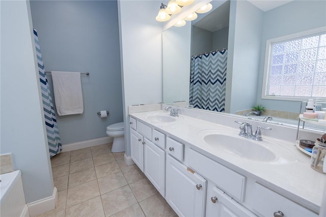 bathroom with tile patterned flooring, vanity, a notable chandelier, and toilet