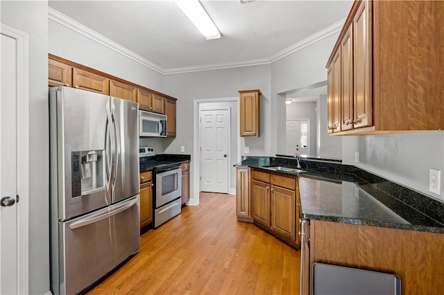 115 Cove View Ct, Seneca, SC 29678 - kitchen with crown molding, brown cabinets, a sink, stainless steel appliances, and light wood-style flooring