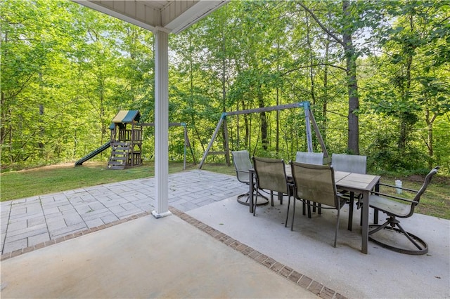 115 Cove View Ct, Seneca, SC 29678 - view of patio with a forest view, outdoor dining area, and a playground