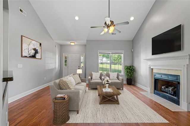 115 Cove View Ct, Seneca, SC 29678 - living area featuring visible vents, wood finished floors, a fireplace, a ceiling fan, and vaulted ceiling
