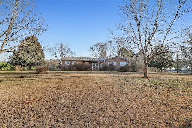 ranch-style house with a front yard