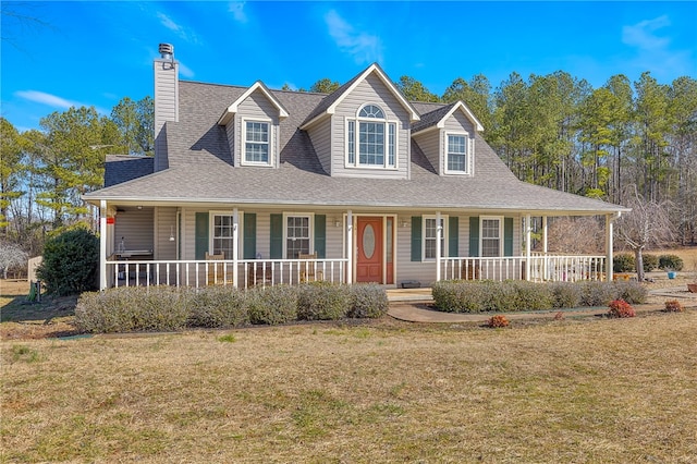 view of front of house with covered porch and a front lawn