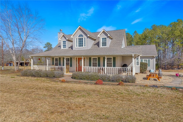 view of front of property with a front yard and covered porch