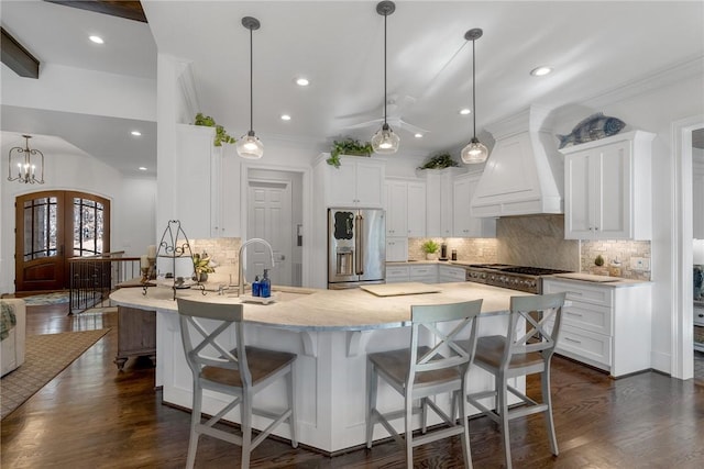 800 Mirror Lake Ct, Salem, SC 29676 - kitchen featuring stainless steel refrigerator with ice dispenser, custom exhaust hood, a kitchen bar, backsplash, and crown molding