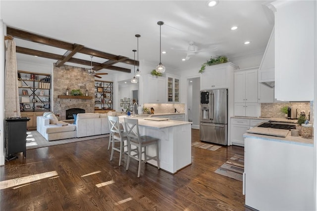 800 Mirror Lake Ct, Salem, SC 29676 - kitchen with high quality fridge, a ceiling fan, a stone fireplace, a peninsula, and light countertops
