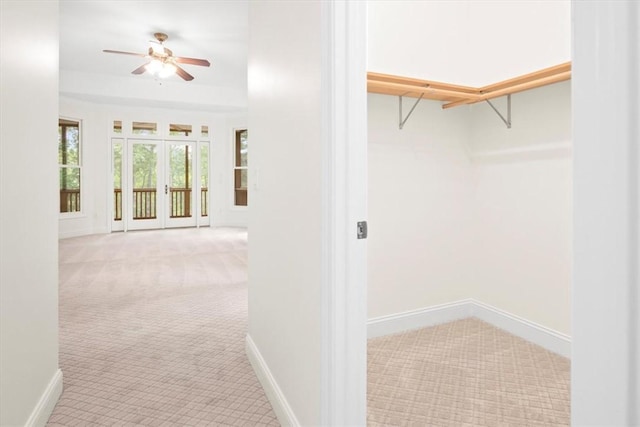 interior space featuring ceiling fan, carpet flooring, and french doors