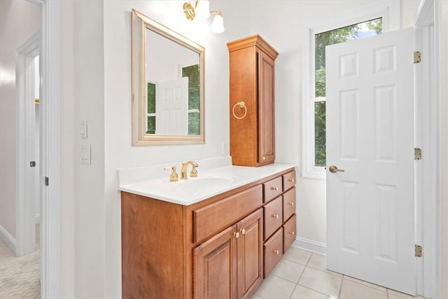 bathroom featuring tile patterned flooring and vanity