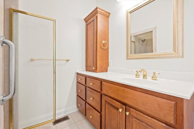 bathroom with a shower stall, visible vents, tile patterned flooring, and vanity