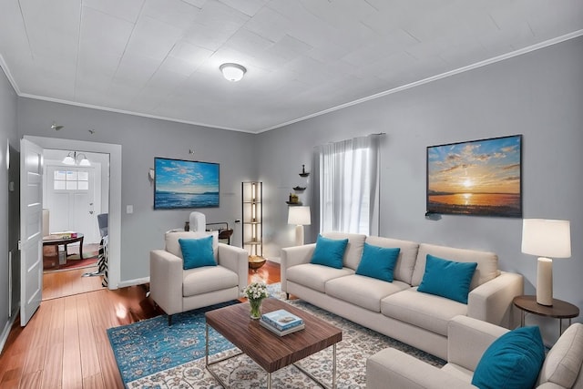 living room featuring crown molding and wood-type flooring