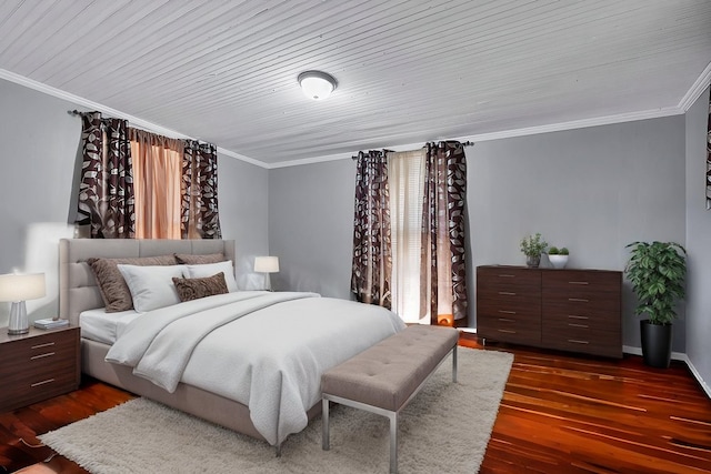 bedroom with crown molding and dark hardwood / wood-style floors