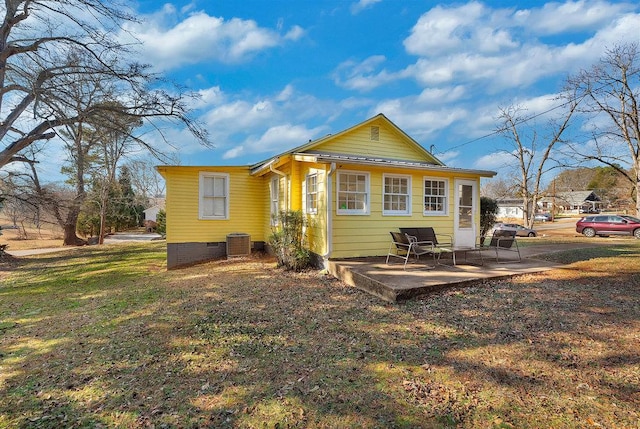 rear view of house with a patio area and central air condition unit