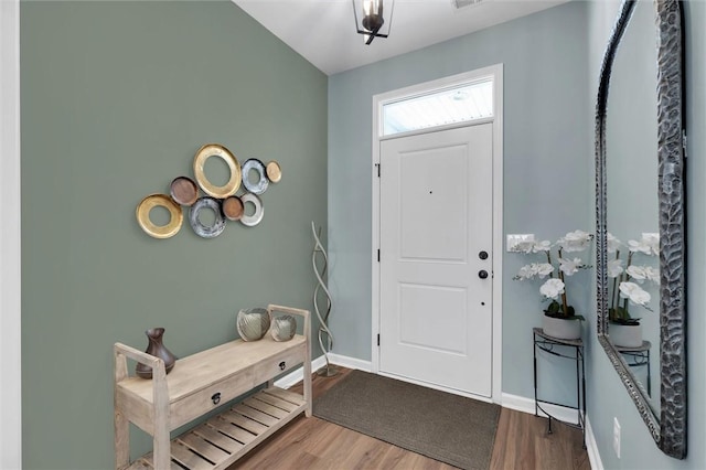 entryway with hardwood / wood-style floors