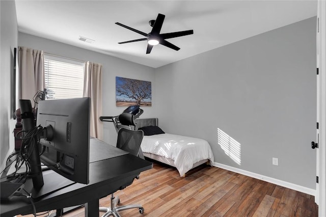 bedroom featuring hardwood / wood-style flooring and ceiling fan