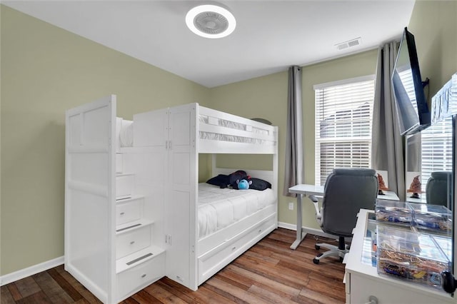 bedroom with wood-type flooring