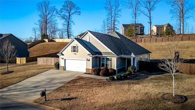 view of front facade with a garage and a front yard