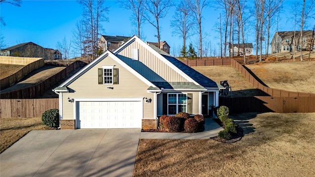 view of front facade with a garage and a front lawn