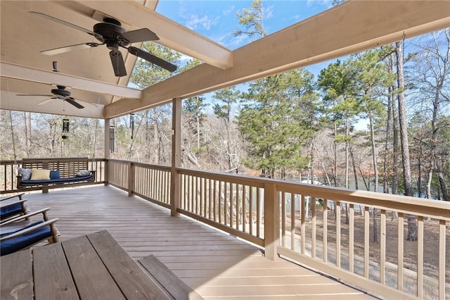 wooden terrace featuring ceiling fan