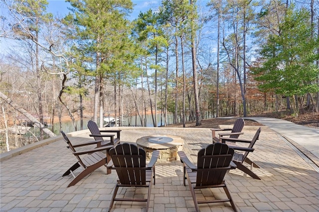 view of patio / terrace featuring an outdoor fire pit