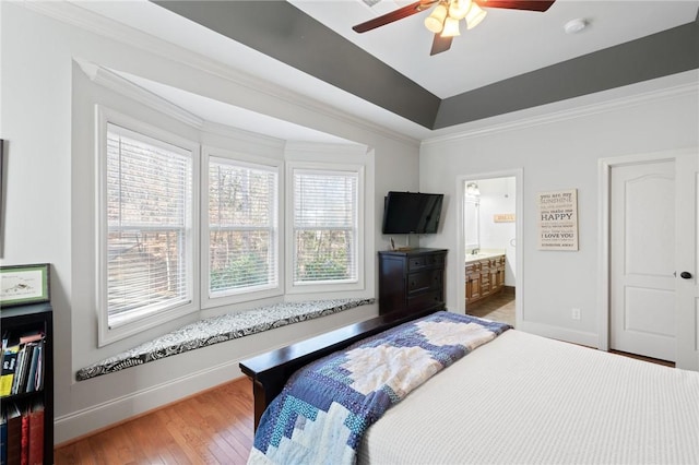 bedroom with ceiling fan, ornamental molding, ensuite bathroom, and wood-type flooring