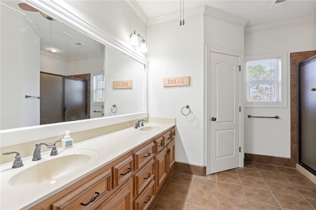 bathroom featuring vanity, crown molding, a shower with shower door, and tile patterned floors