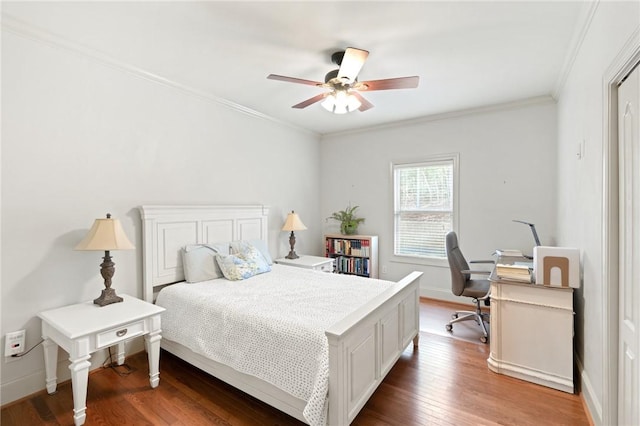 bedroom featuring wood-type flooring, ornamental molding, and ceiling fan