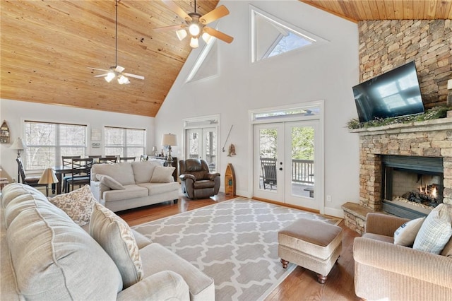 living room with french doors, wood-type flooring, a fireplace, and wooden ceiling