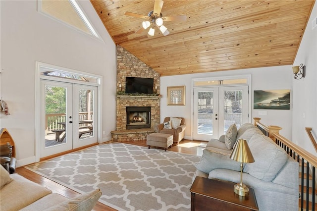 living room with high vaulted ceiling, a fireplace, wood-type flooring, wooden ceiling, and french doors