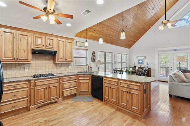 kitchen featuring sink, dishwasher, tasteful backsplash, gas stovetop, and decorative light fixtures