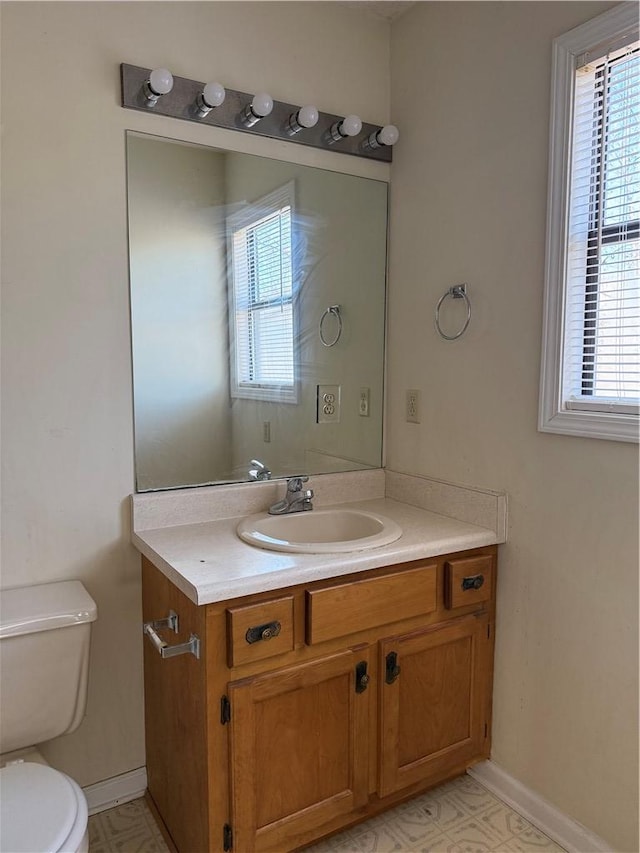 bathroom featuring vanity and toilet