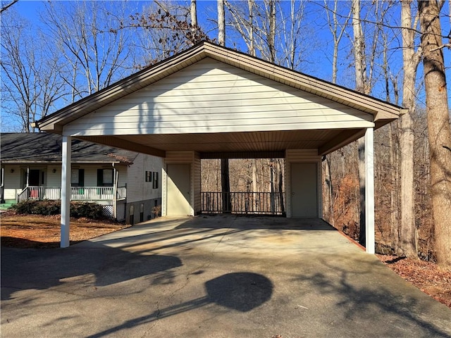 view of front of house with a carport and a porch