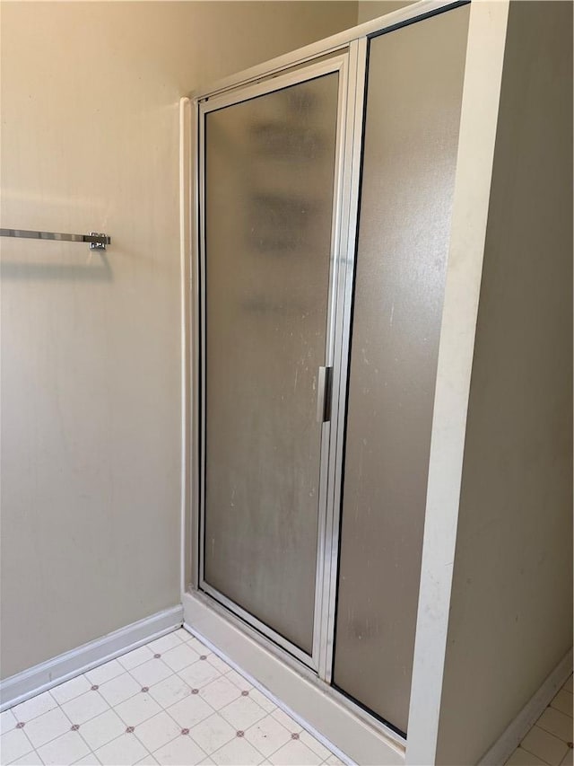 bathroom with a shower with shower door