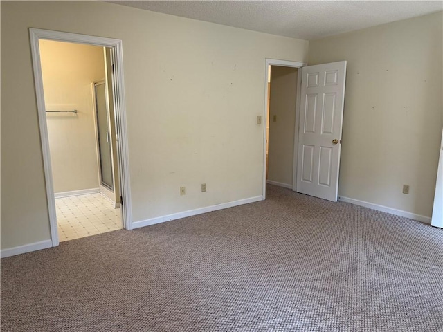 unfurnished bedroom featuring light carpet