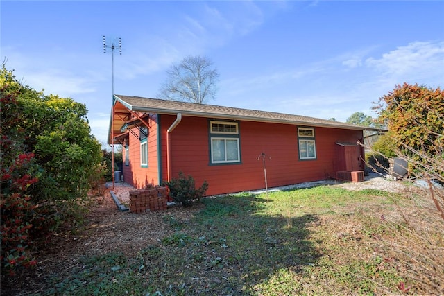 view of home's exterior with a lawn