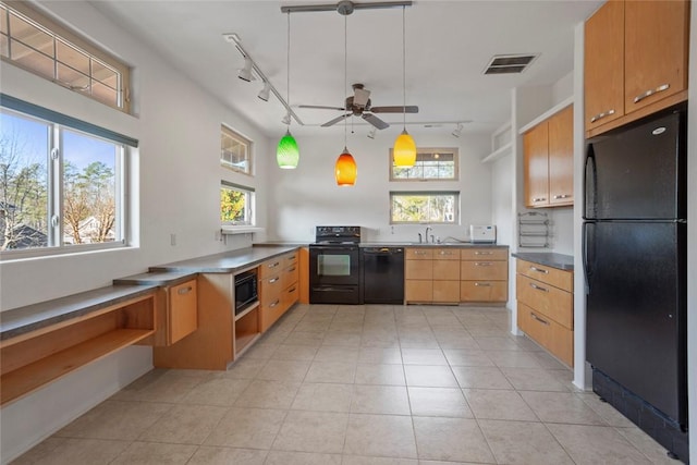 kitchen featuring light tile patterned floors, sink, ceiling fan, hanging light fixtures, and black appliances