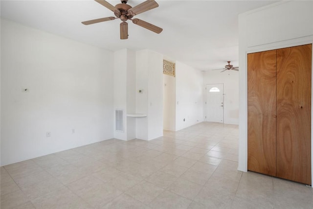 unfurnished room featuring ceiling fan