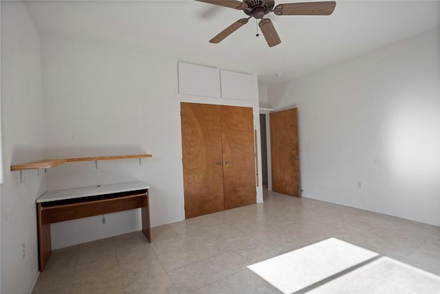 unfurnished bedroom featuring ceiling fan