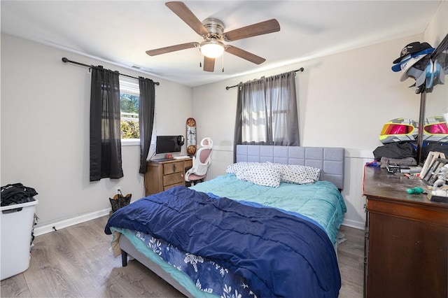 bedroom featuring ceiling fan and hardwood / wood-style floors