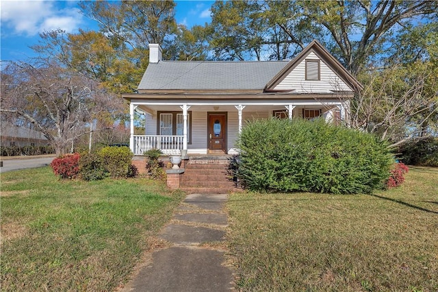 view of front of home featuring a porch and a front lawn