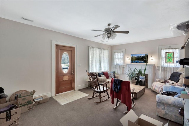 living room with ceiling fan and light carpet