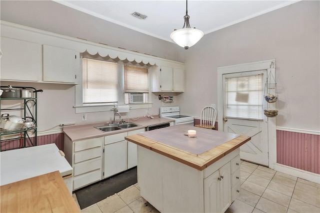 kitchen with sink, white cabinetry, a center island, hanging light fixtures, and white range with electric cooktop